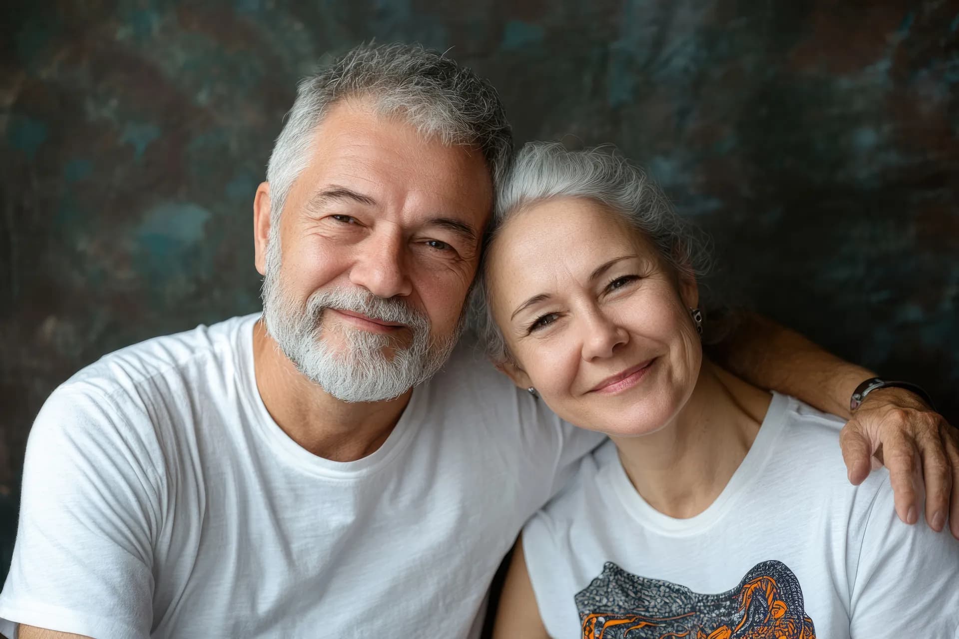 An older couple smiling warmly together